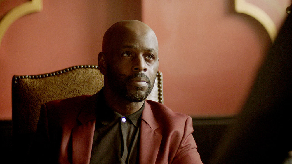 QUEEN OF THE SOUTH -- "The Fox in the Hen House" Episode 507 -- Pictured in this screengrab: Alimi Ballard as Marcel Dumas -- (Photo by: USA Network)
