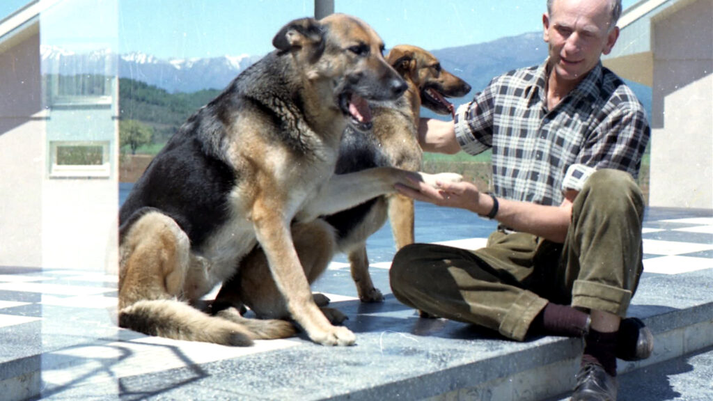 Colonia Dignidad_Sect leader Paul SchaÌ_fer with two German shepherds, approx. 1970 Â© LOOKSfilm