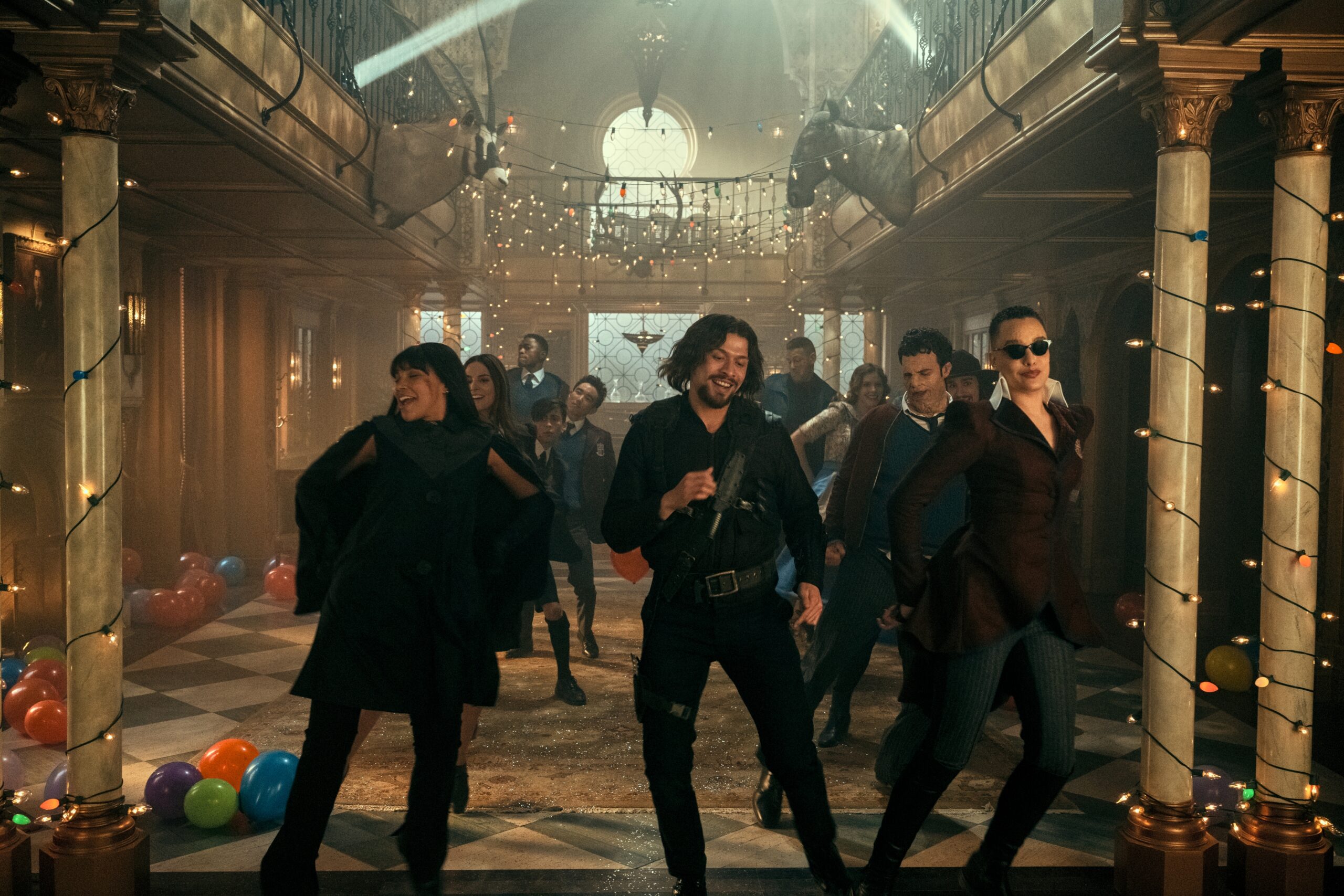 The Umbrella Academy. (L to R) Emmy Raver-Lampman as Allison Hargreeves, Genesis Rodriguez as Sloane, Justin Cornwell as Marcus, Aidan Gallagher as Number Five, Justin H. Min as Ben Hargreeves, David Castaeda as Diego Hargreeves, Tom Hopper as Luther Hargreeves, Jordan Claire Robbins as Grace, Jake Epstein as Alphonso, Robert Sheehan as Klaus Hargreeves, Britne Oldford as Fei in episode 301 of The Umbrella Academy. Cr. Christos Kalohoridis/Netflix © 2022