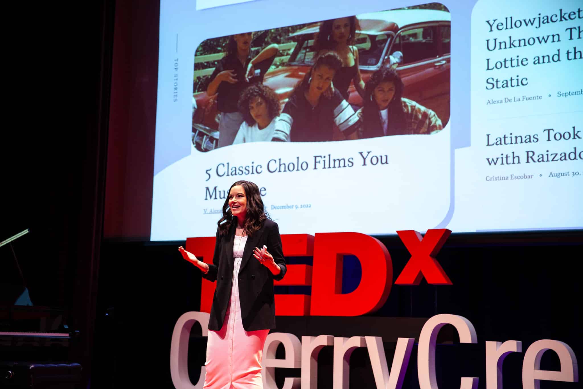 Cristina Escobar on the TEDx stage, talking Latina Media Co