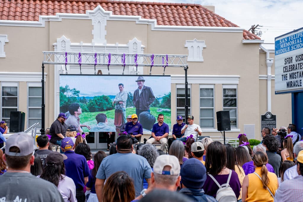 Members of the cast and crew talked about The Long Game in front of the former San Felipe High School.