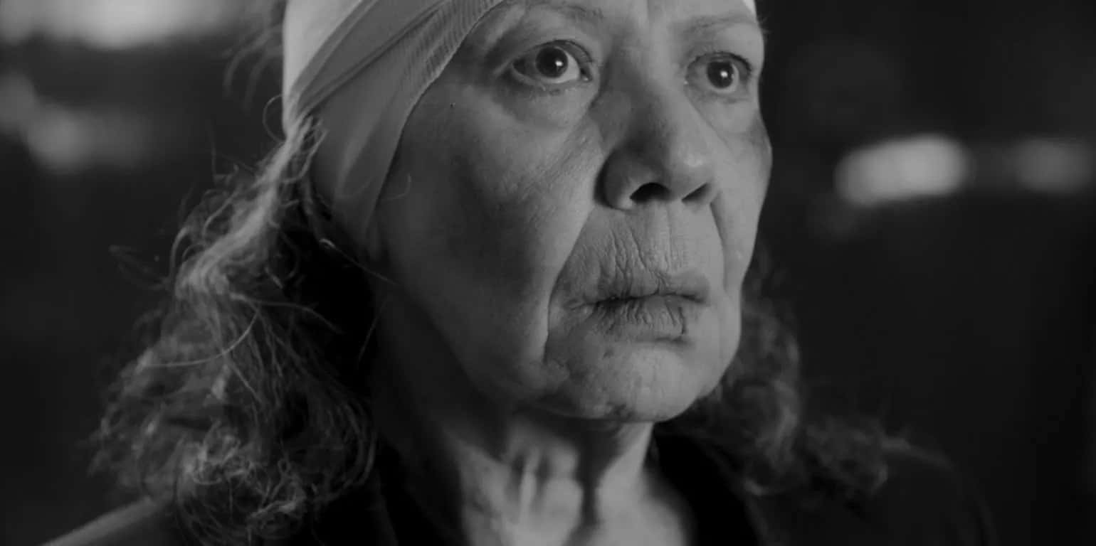 Black-and-white close-up of an older woman in We Shall Not Be Moved, a film where Latin American women face violence.